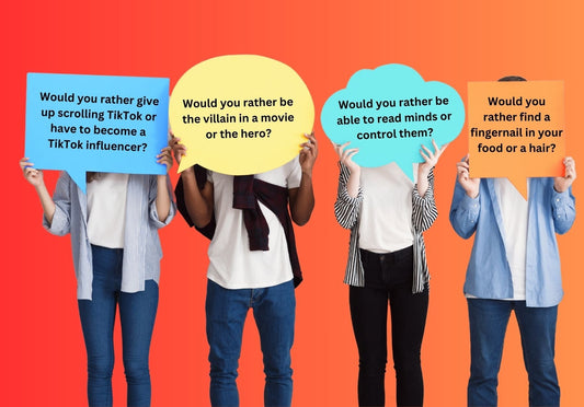 Teenagers holding up fun Would You Rather Questions on speech bubble cards