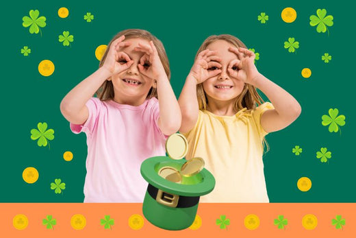 Two kids searching for treasure. Irish St Patricks Day themed background and leprechaun hat filled with gold coins